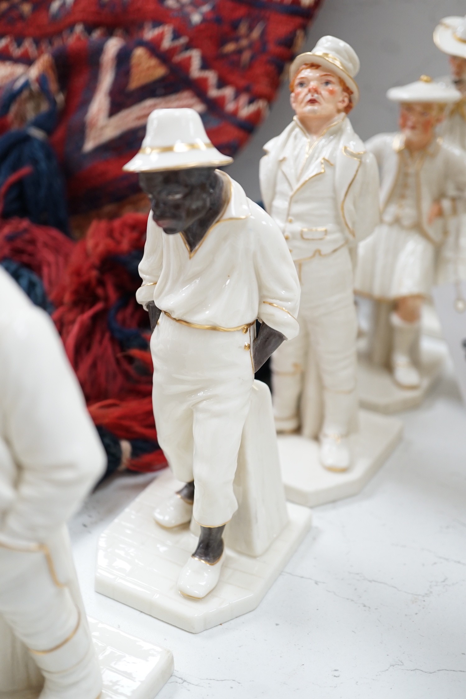 Seven Royal Worcester Hadleys figures of the World, tallest 17.5 cm